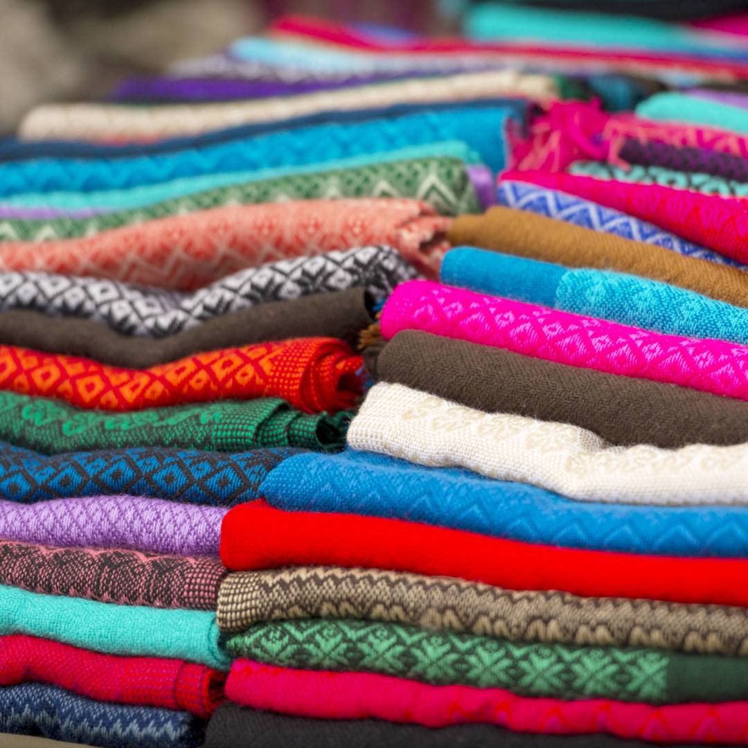 Colorful stack of handcrafted material at a market in San Cristobal, Mexico